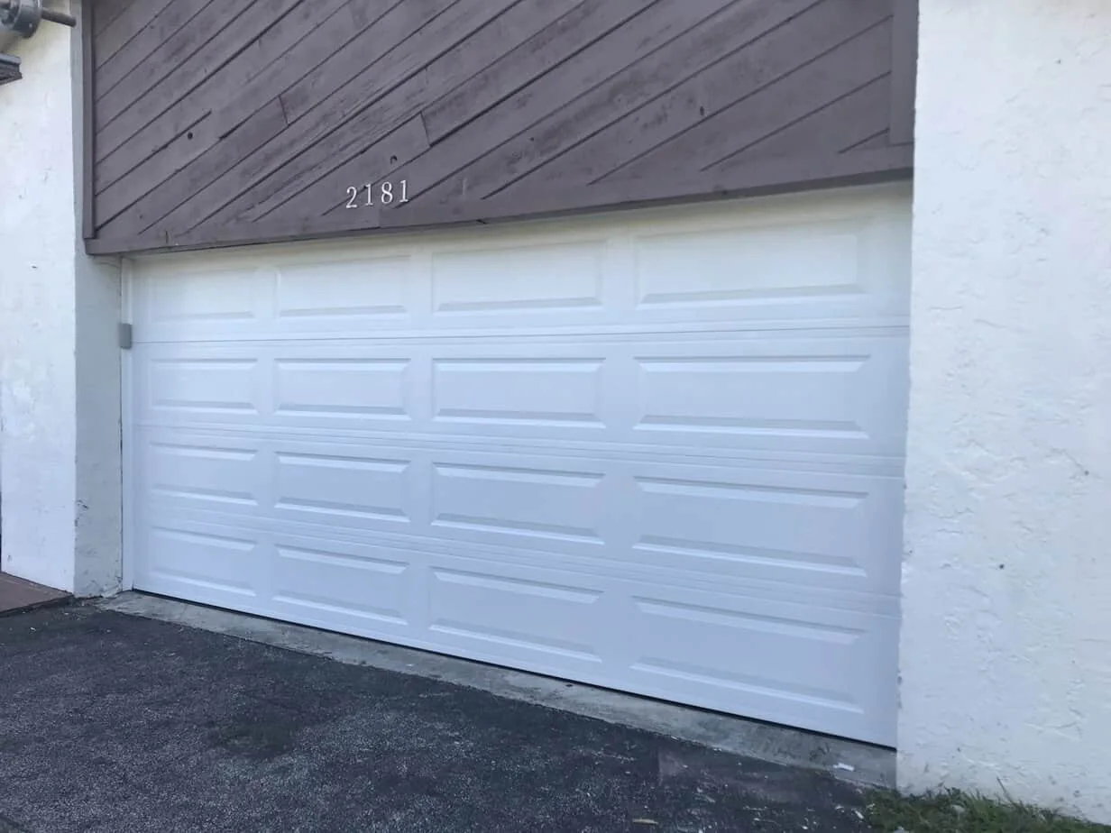 White sectional door and exterior trim